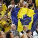 Michigan fans waves a maize and blue Canadian flag for freshman Nik Stauskas in the second half at Crisler Center on Sunday, Jan. 6. Michigan beat Iowa 95-67 in the Big Ten home opener. Melanie Maxwell I AnnArbor.com